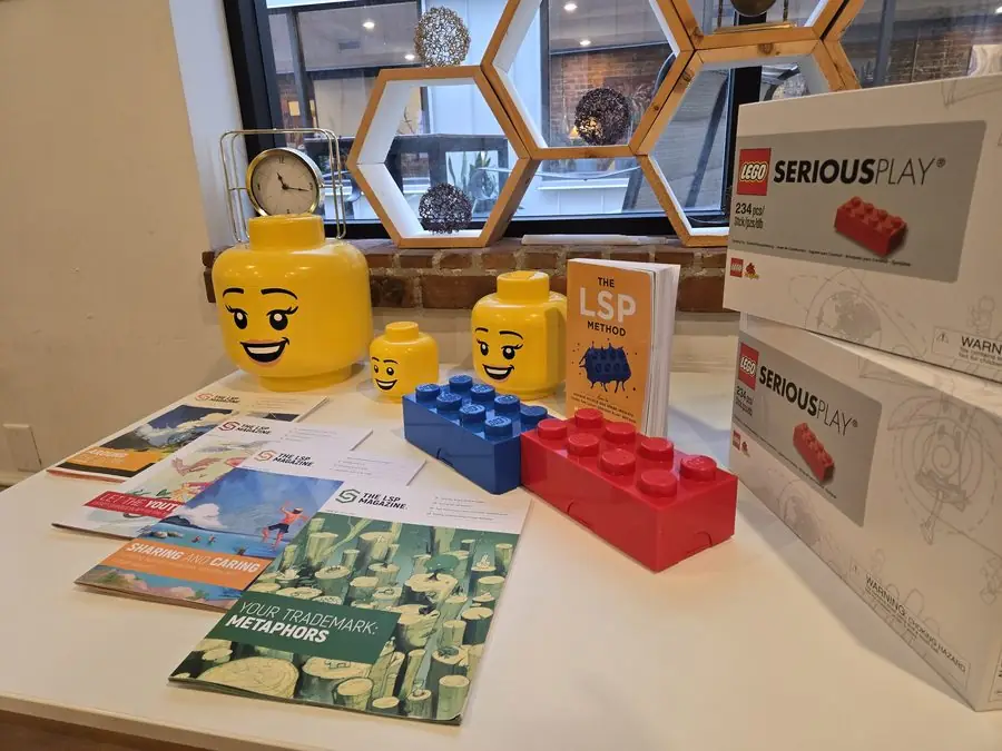 LEGO Serious Play Starter Kit boxes and a copy of The LSP Method set out at the start of the November 2025 Vancouver cohort